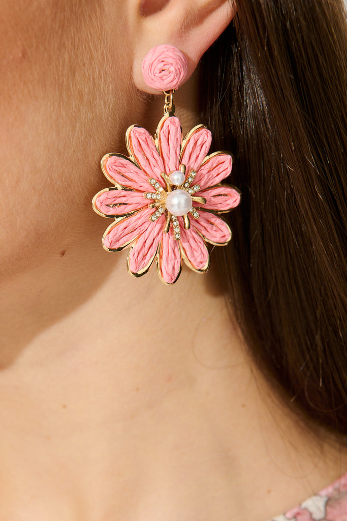 Flora Drop Earrings in Pink and Gold Daisy Raffia on model close up