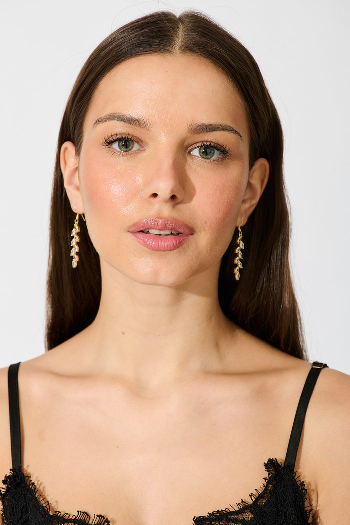 Mikayla Earrings in Gold on model front