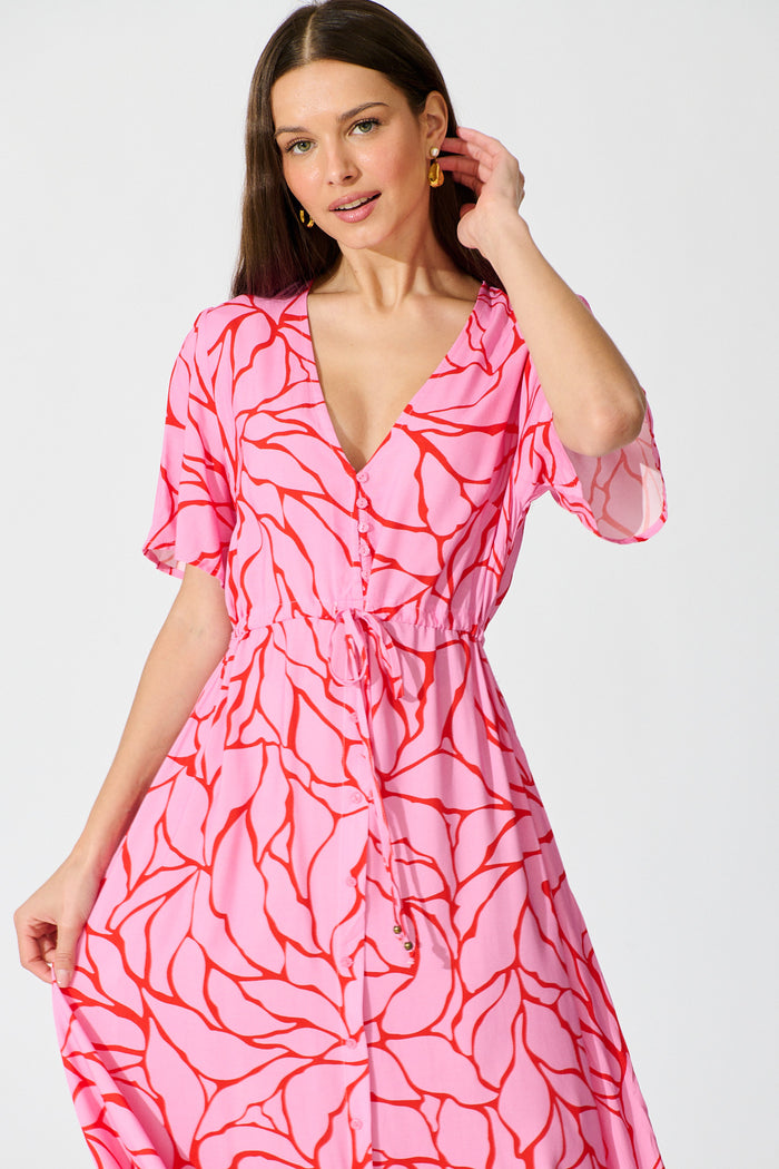 Melody Midi Dress in in Pink Geometric Print front