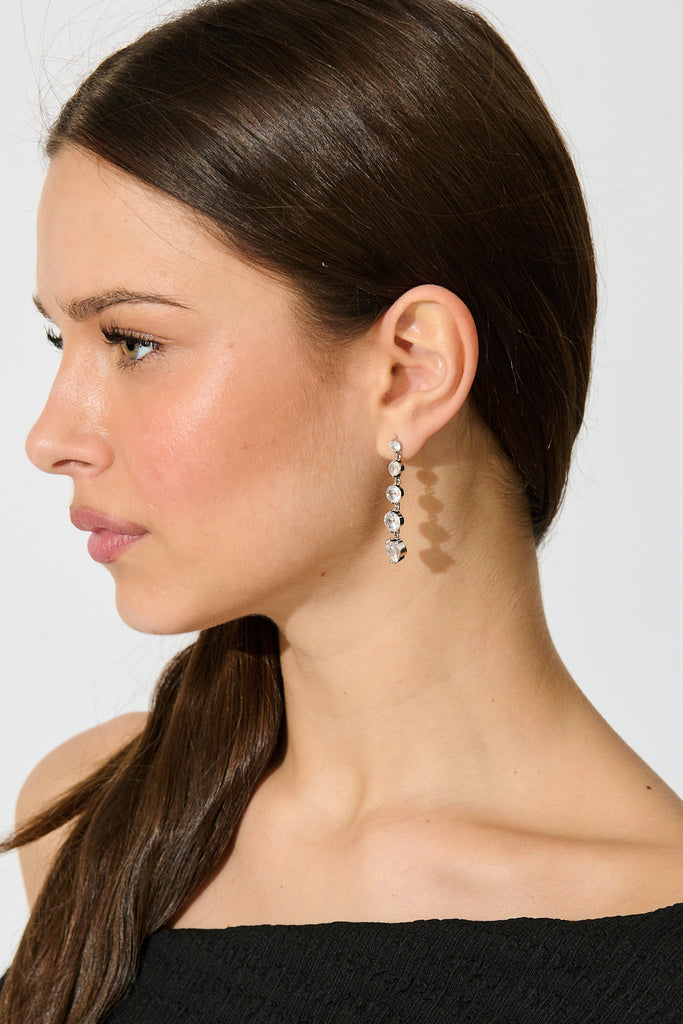 Carlene Drop Earrings in Silver Cubic Zirconia on model side