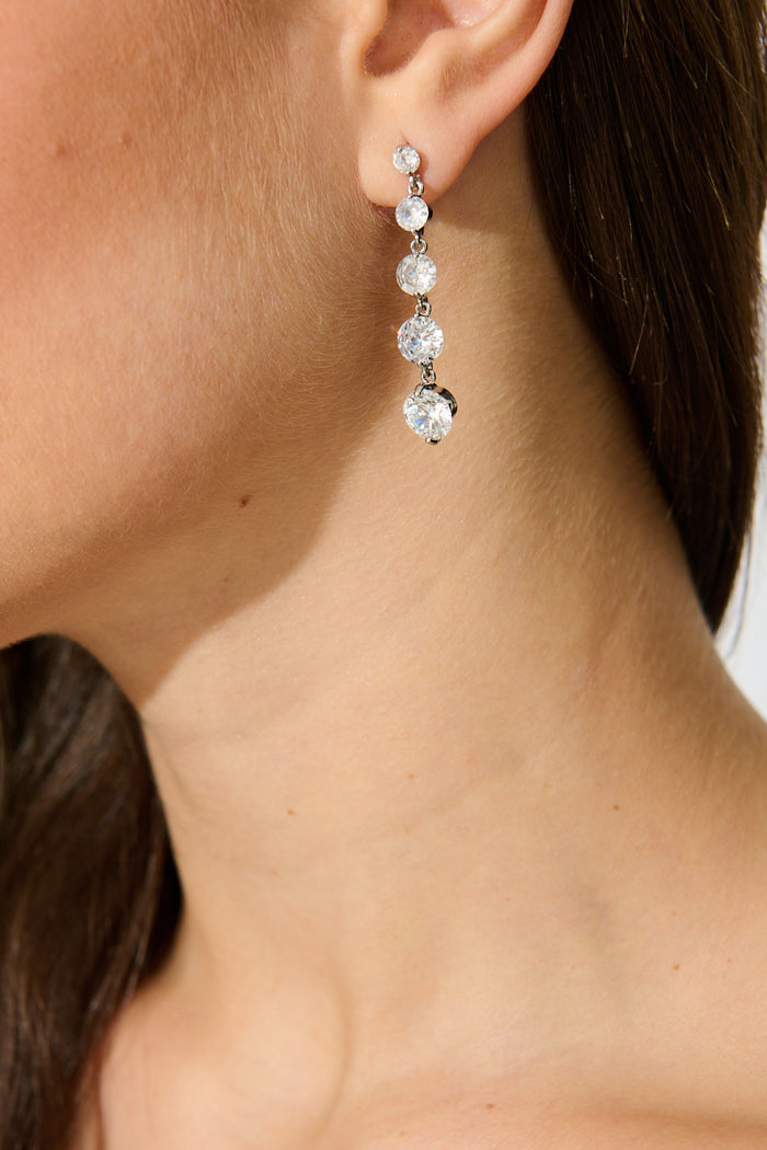 Carlene Drop Earrings in Silver Cubic Zirconia on model close up