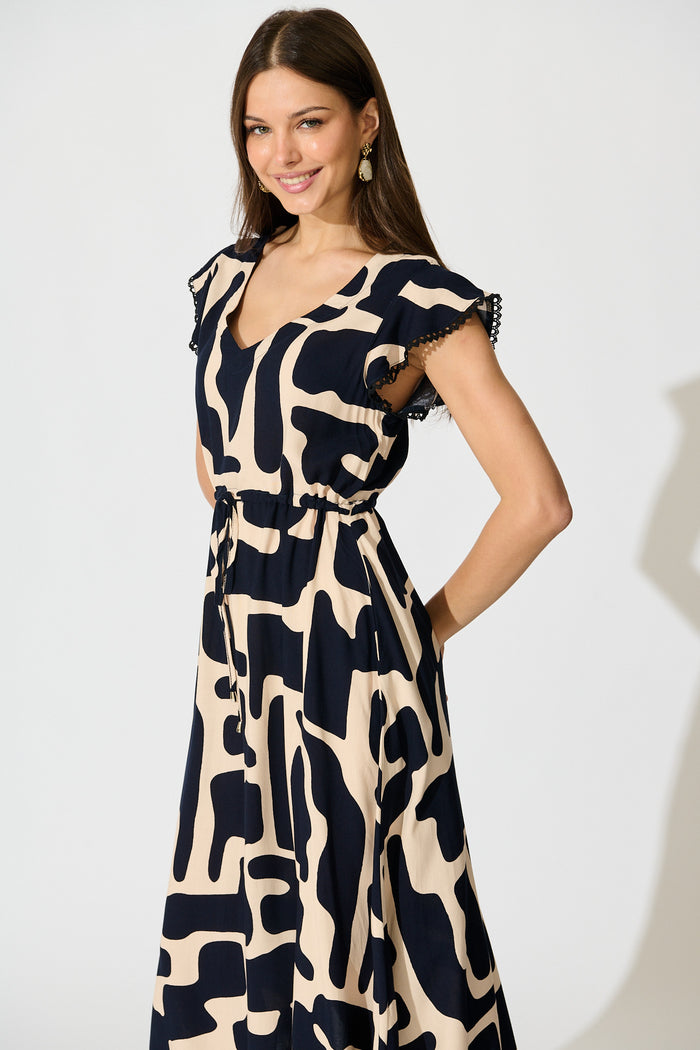 Atana Midi Dress in Black and Beige Geometric Print front