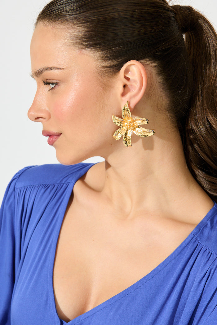 Lianne Lily Stud Earrings in Gold on model side