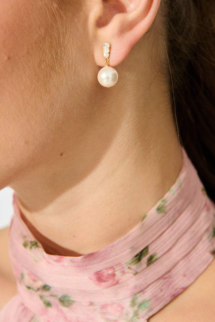 Elise Earrings in Gold with Pearl on model close up