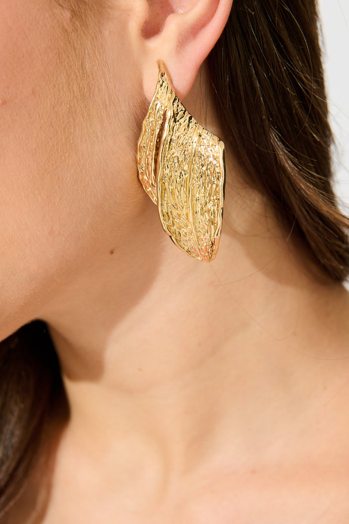 Naomi Leaf Drop Earrings in Textured Gold on model close up