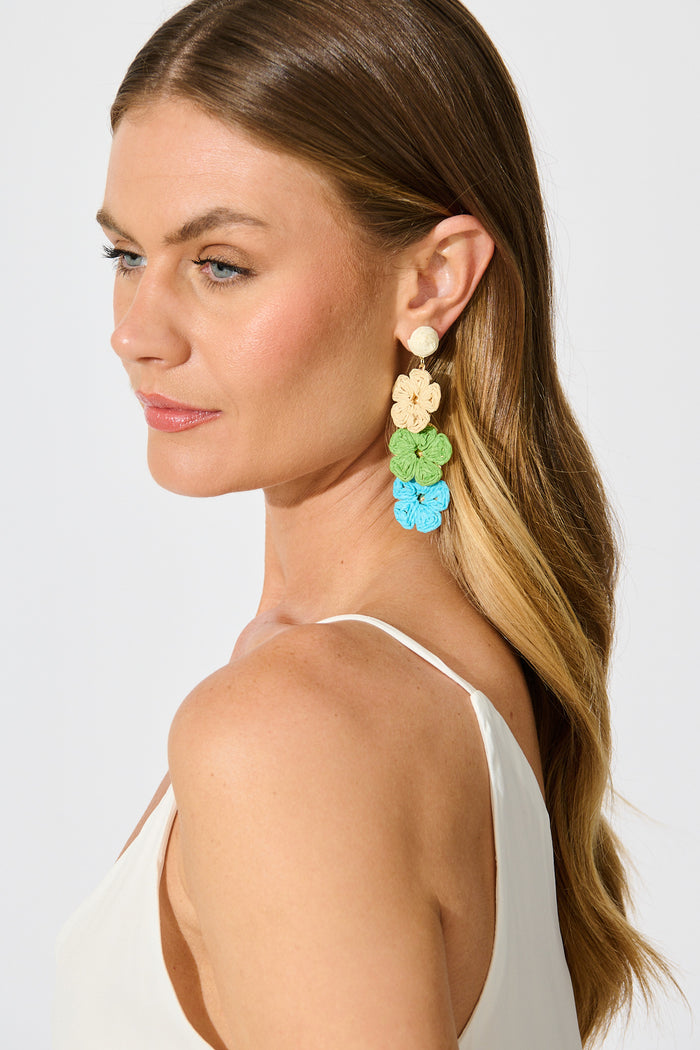 Patty Drop Earrings in Multi Cream and Aqua Raffia on model side