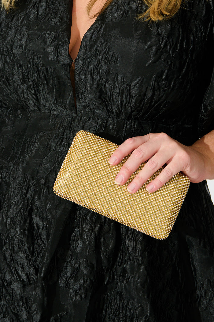 Stella Evening Clutch in Gold Crystal Mesh on model front