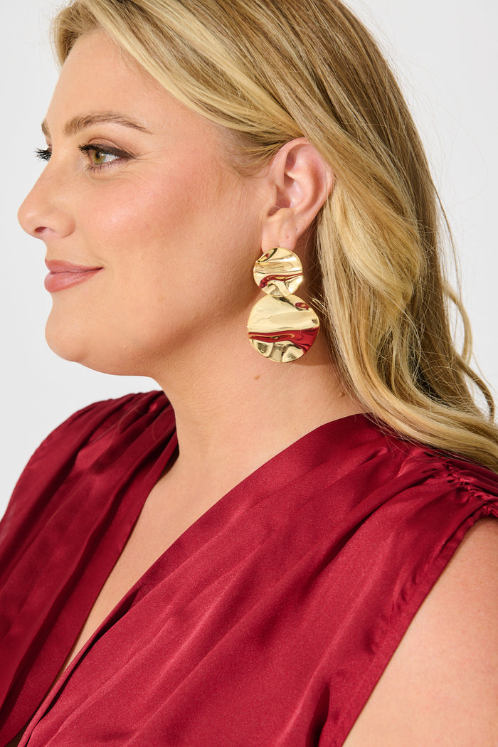 Sarai Drop Earrings in Gold Textured on model side