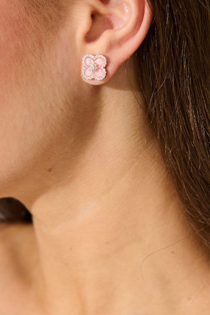 Ayala Stud Diamante Earrings in Pink Enamel Clover on model close up