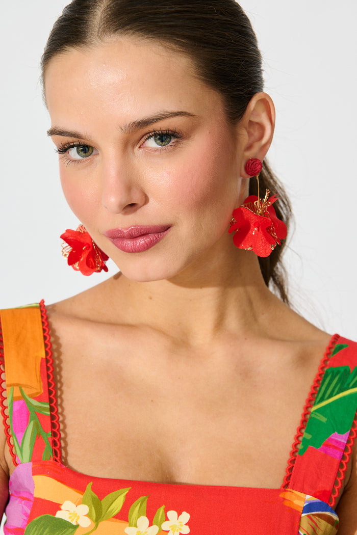 Camila Statement Earrings in Red and Gold Floral on model front