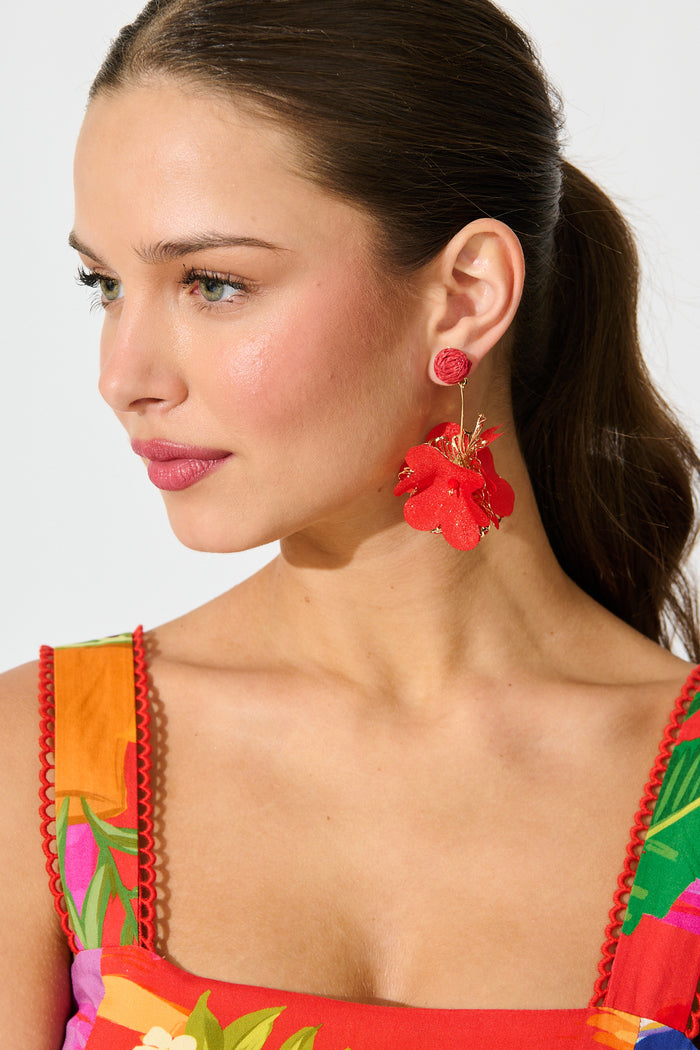 Camila Statement Earrings in Red and Gold Floral on model side