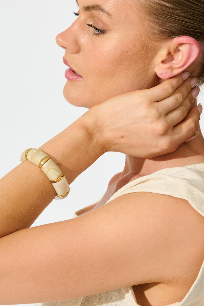 Claudia Chunky Bangle in Cream Marble Resin on model close up