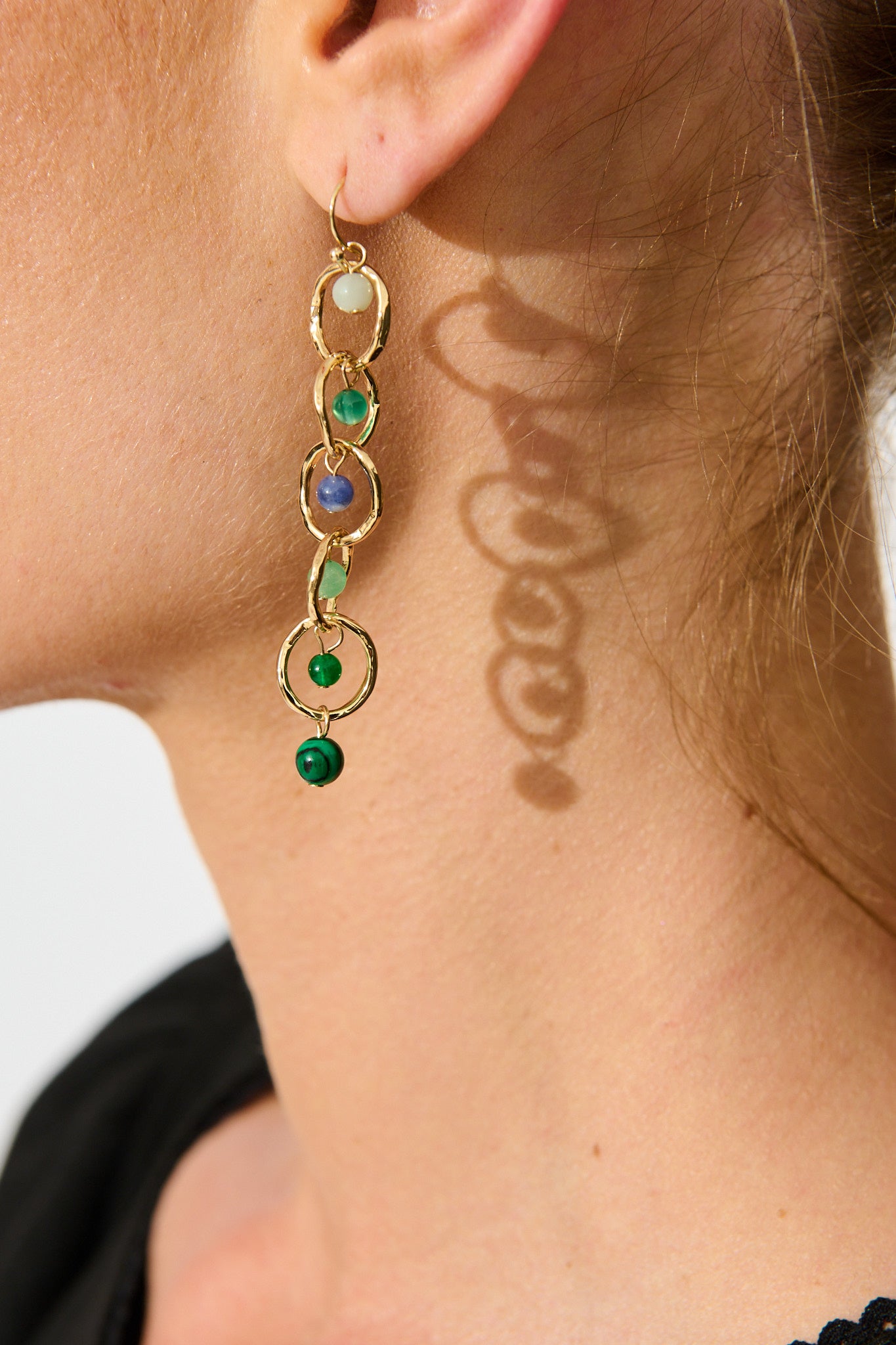 Eva Drop Earrings in Multi Green on model close up