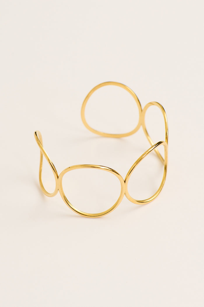 Liora Open Cuff Bangle in Gold flatlay