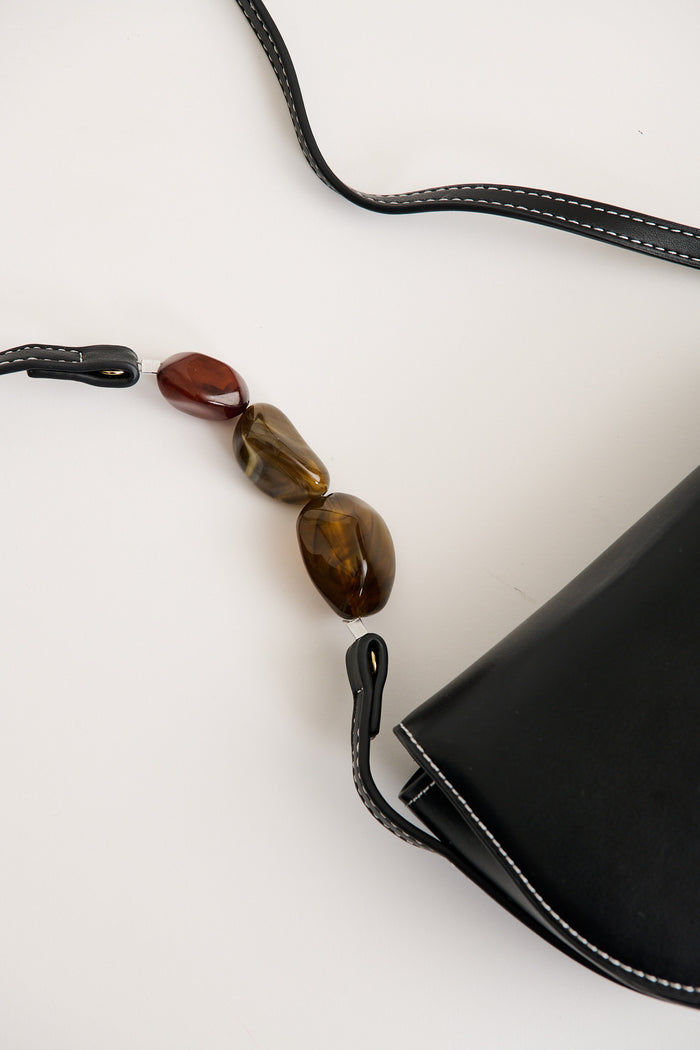 Monroe Crossbody Bag in Black with Resin Beads flatlay close up