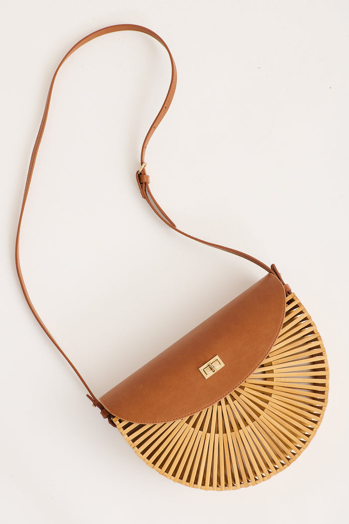 Noely Crossbody Saddle Bag in Tan Bamboo flatlay