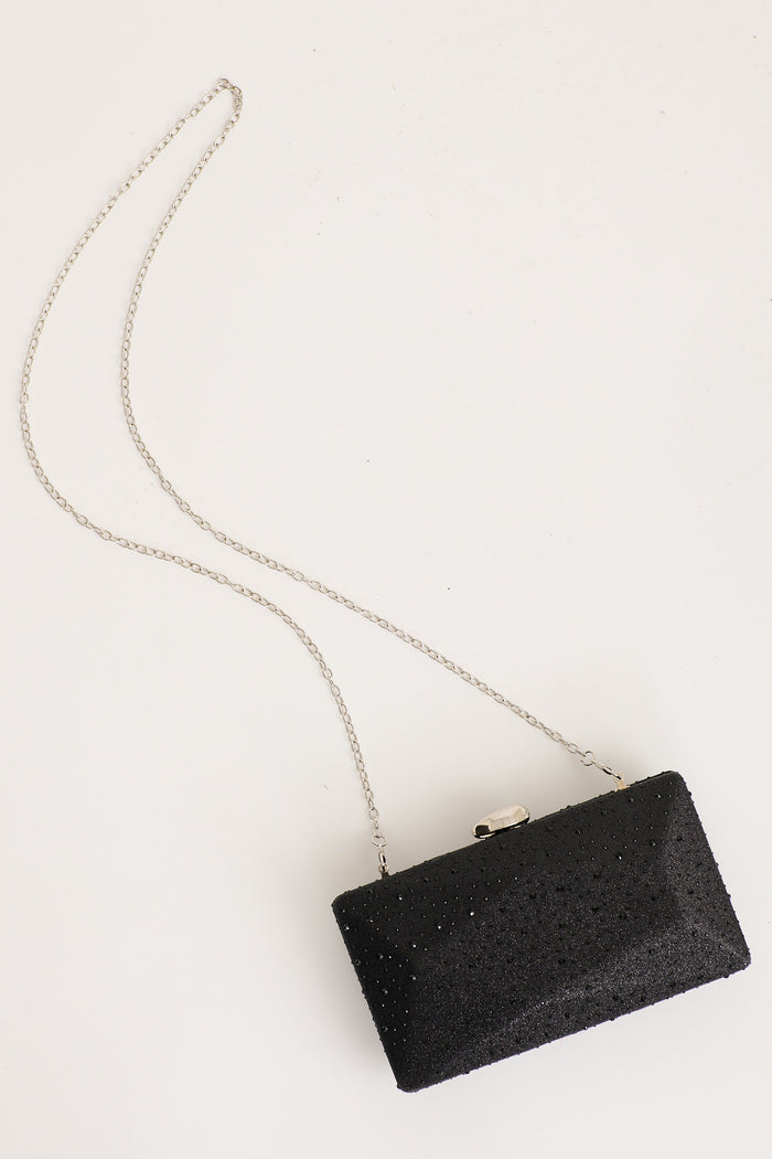 Clara Clutch Bag in Black flatlay strap