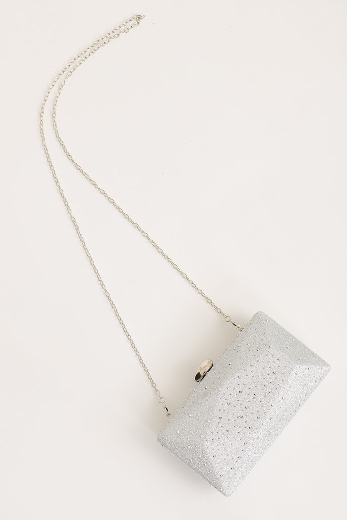 Clara Clutch Bag in Silver flatlay strap