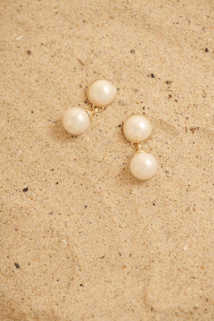 Carla Drop Earrings in Gold with Pearl focus shoot flatlay