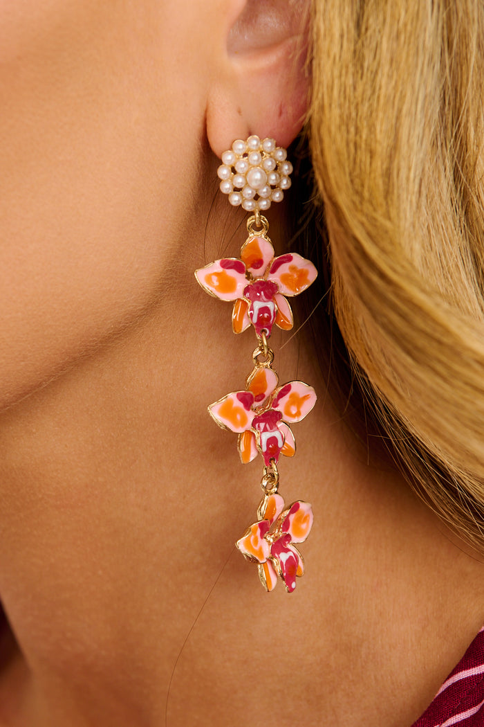 Suri Drop Earrings in Red Floral Cluster with Pearl on model close up