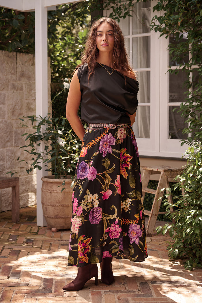Aurora Radiance Maxi Skirt in Black with Multi Floral campaign full length