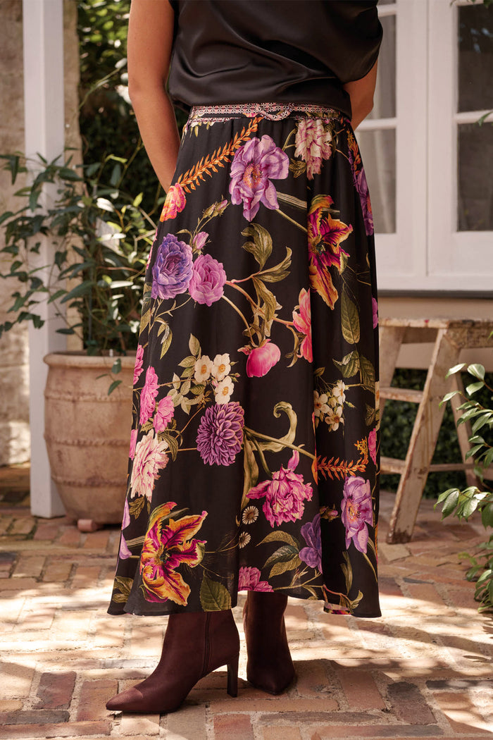 Aurora Radiance Maxi Skirt in Black with Multi Floral campaign front