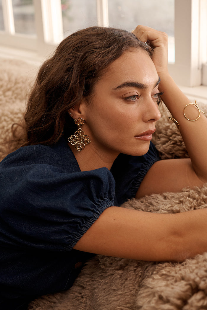 Cleo Filigree Statement Earrings in Antique Gold on model side