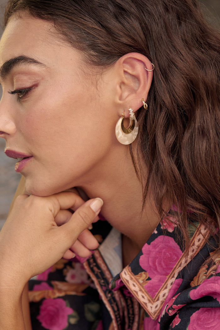 Talia Hoop Earrings in Gold with Cream Marble campaign on model side