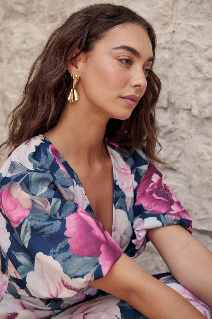 Clio Drop Earrings in Gold on model side