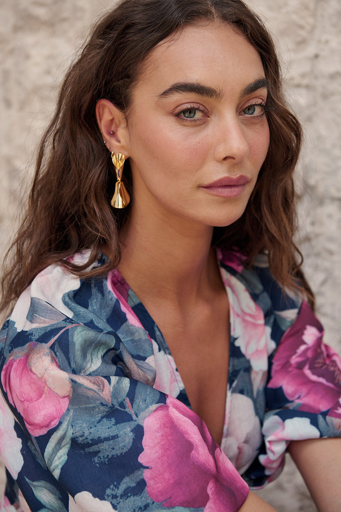 Clio Drop Earrings in Gold on model side