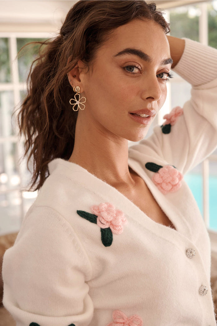 Fleur Bloom Drop Earrings in Gold Outline campaign on model side