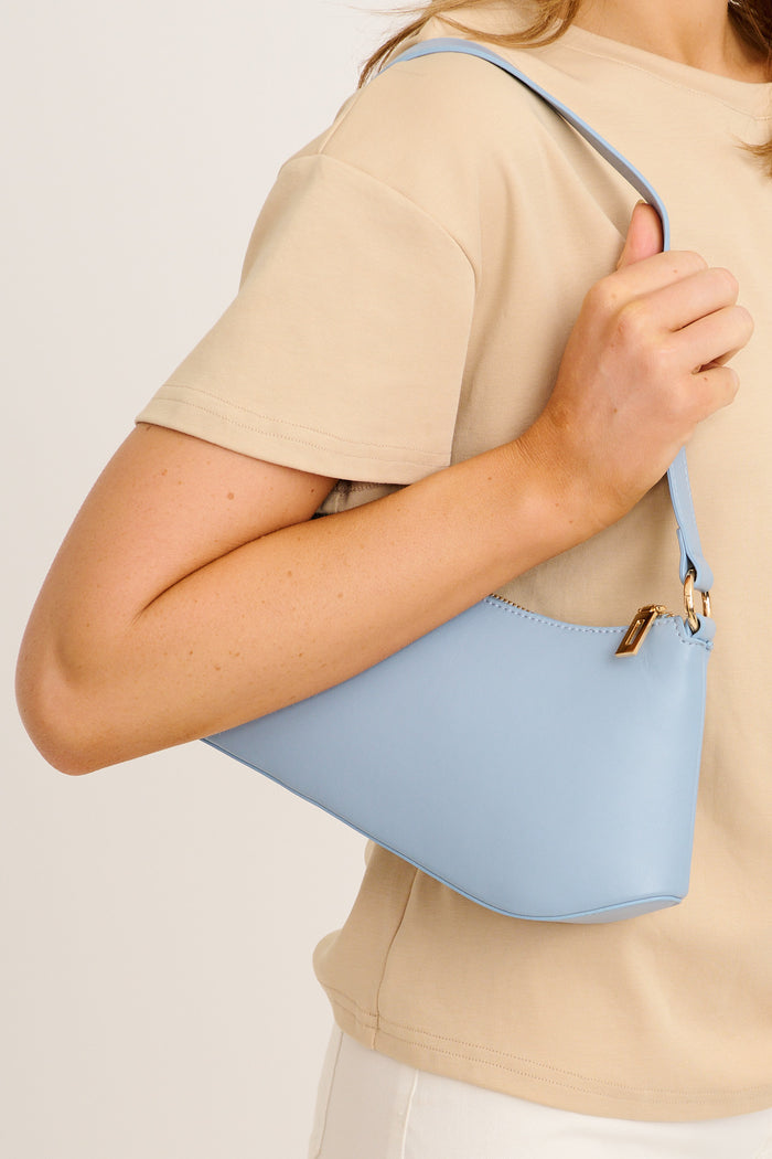 Aria Shoulder Bag in Powder Blue on model side