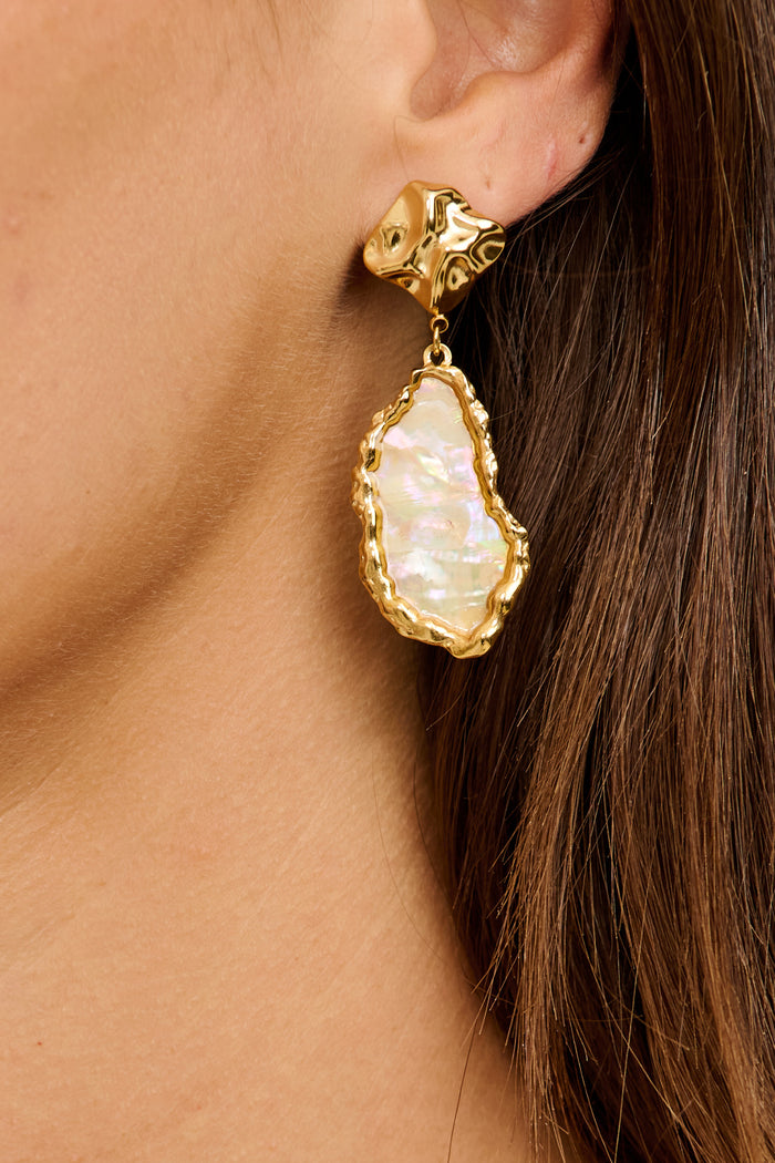 Ariana Stud Earrings in Gold Irregular Iridescent Stone on model close up