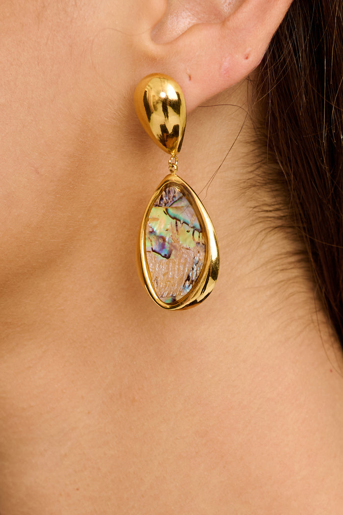 Svetlana Drop Earrings in Gold Teardrop Iridescent Stone on model close up