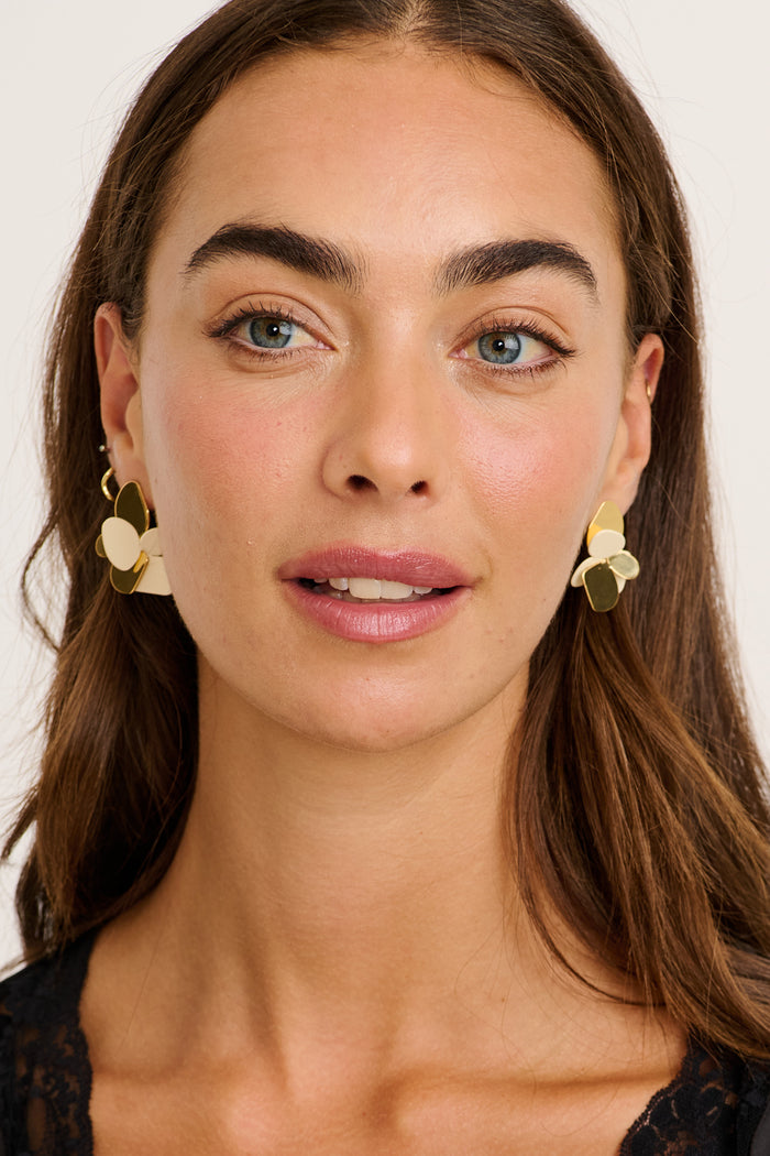 Iris Floral Stud Earrings in Gold on model front