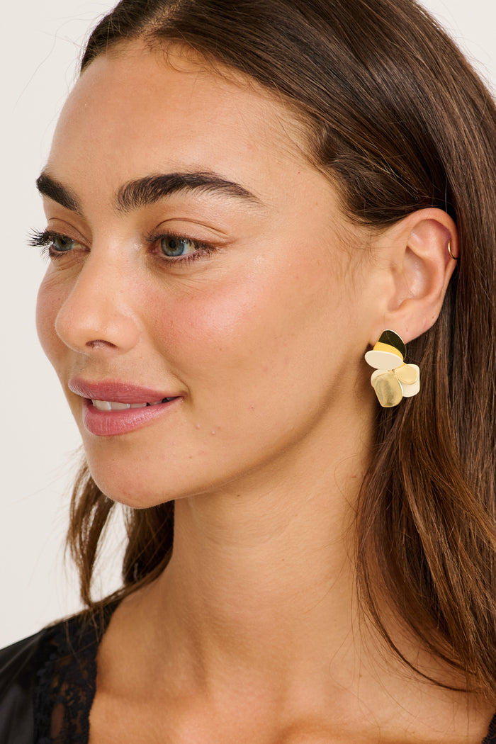 Iris Floral Stud Earrings in Gold on model side