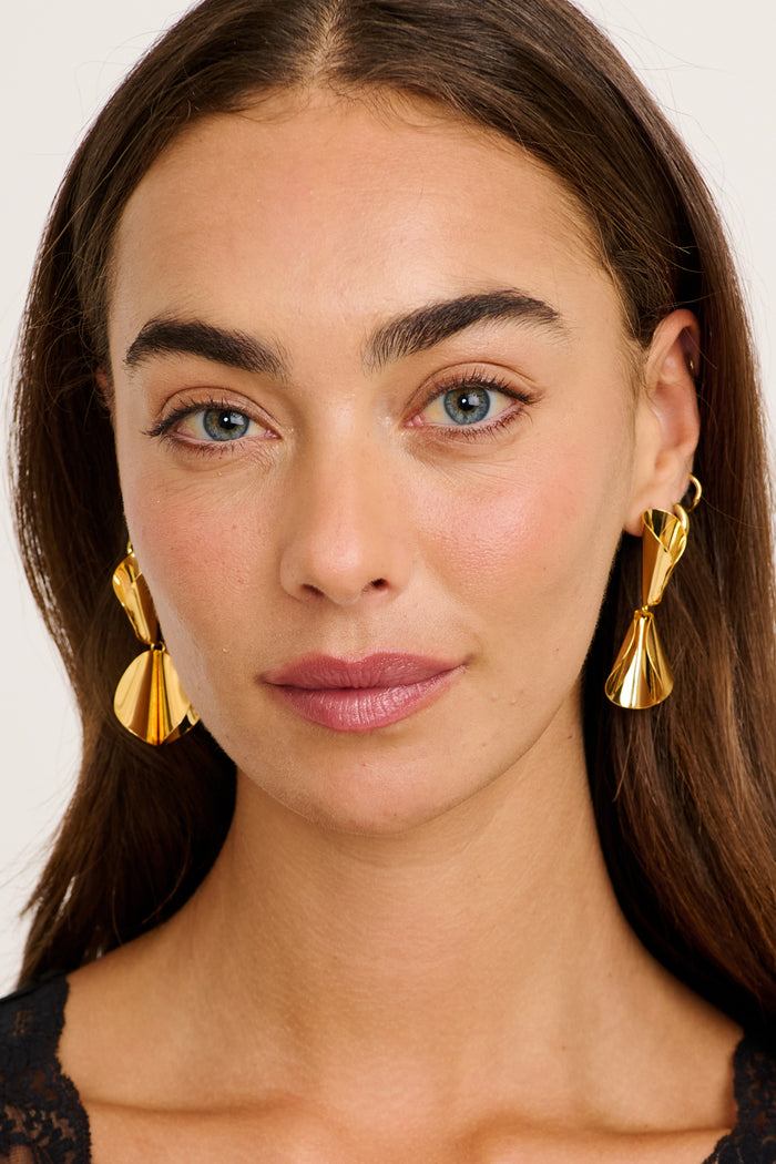 Clio Drop Earrings in Gold on model front