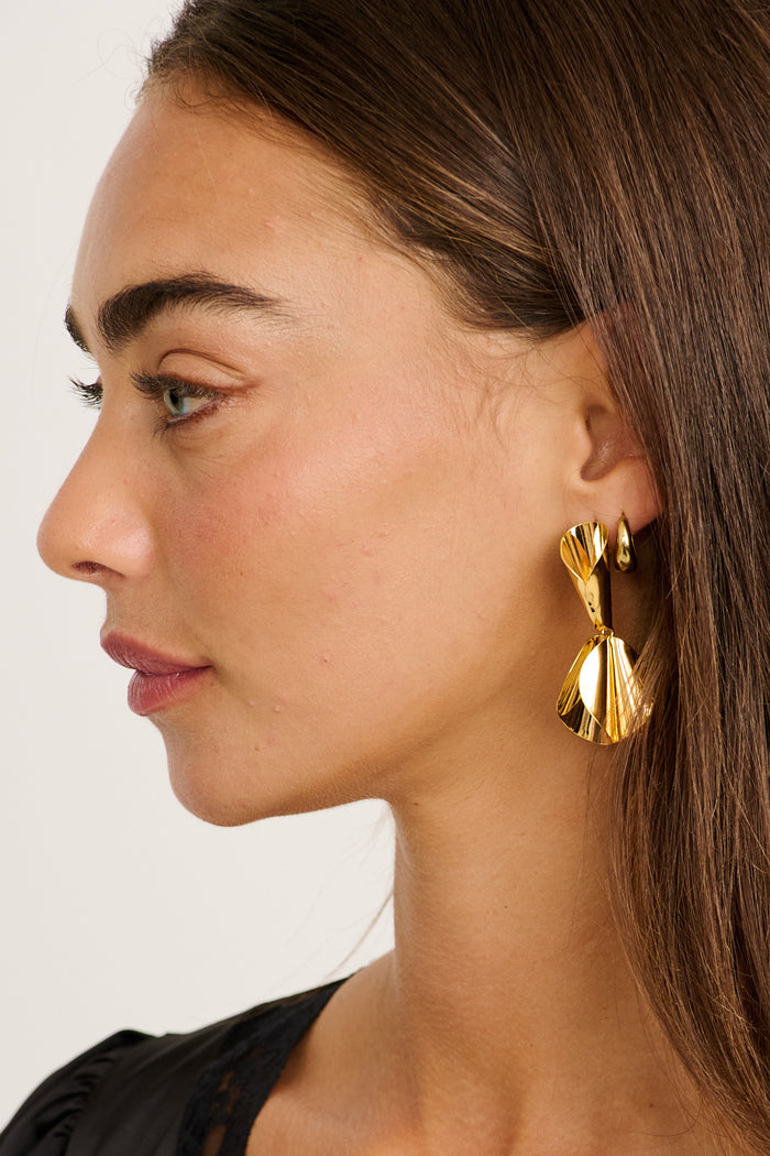 Clio Drop Earrings in Gold on model side