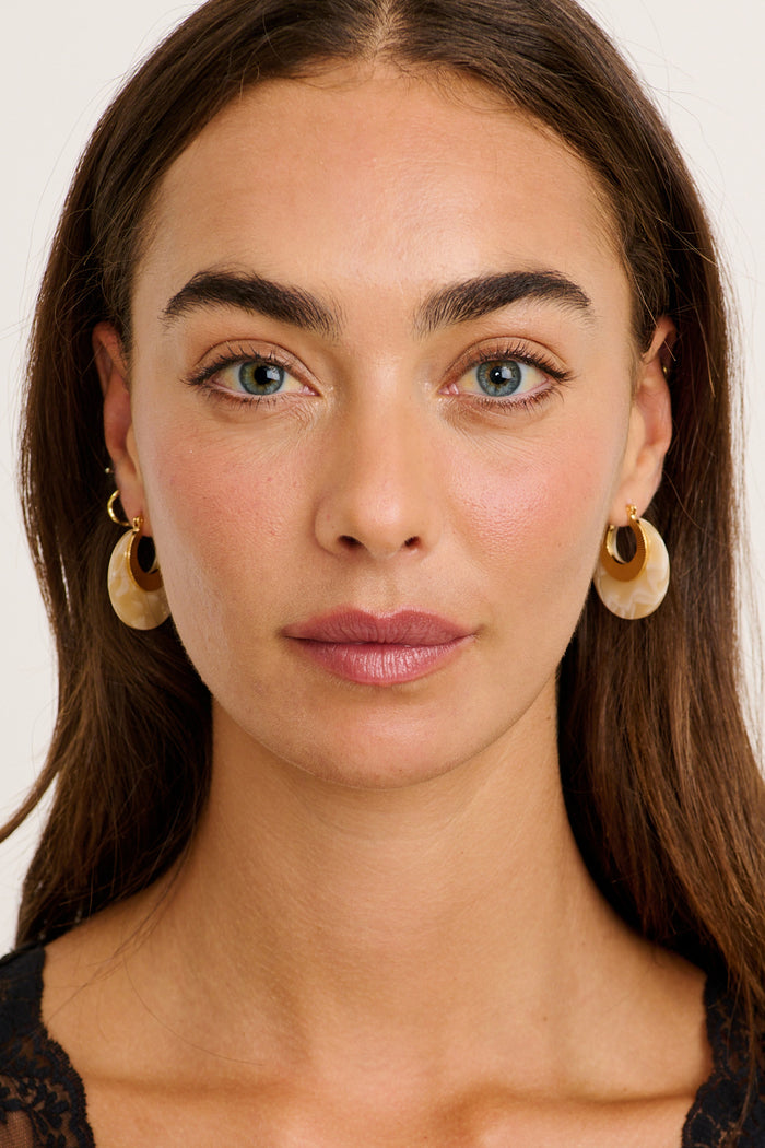 Talia Hoop Earrings in Gold with Cream Marble on model front