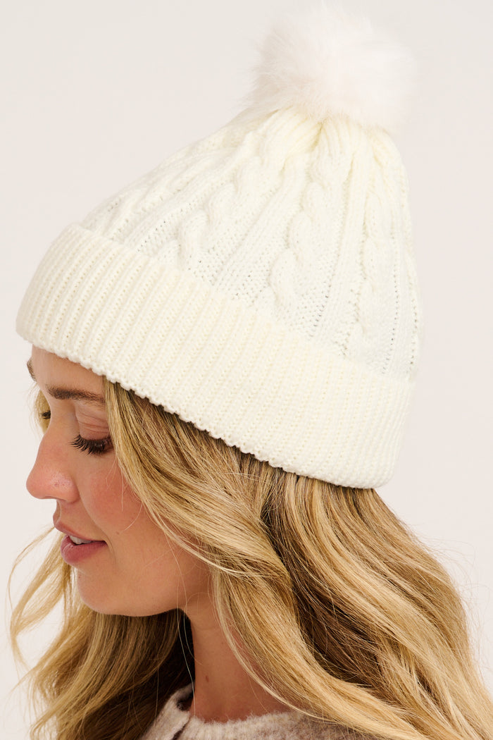 Tessa Cable Knit Beanie in Cream on model side