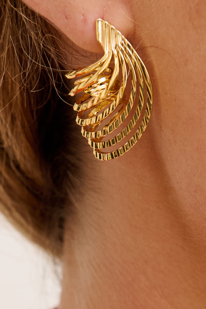 Lumi Earrings in Gold on model close up