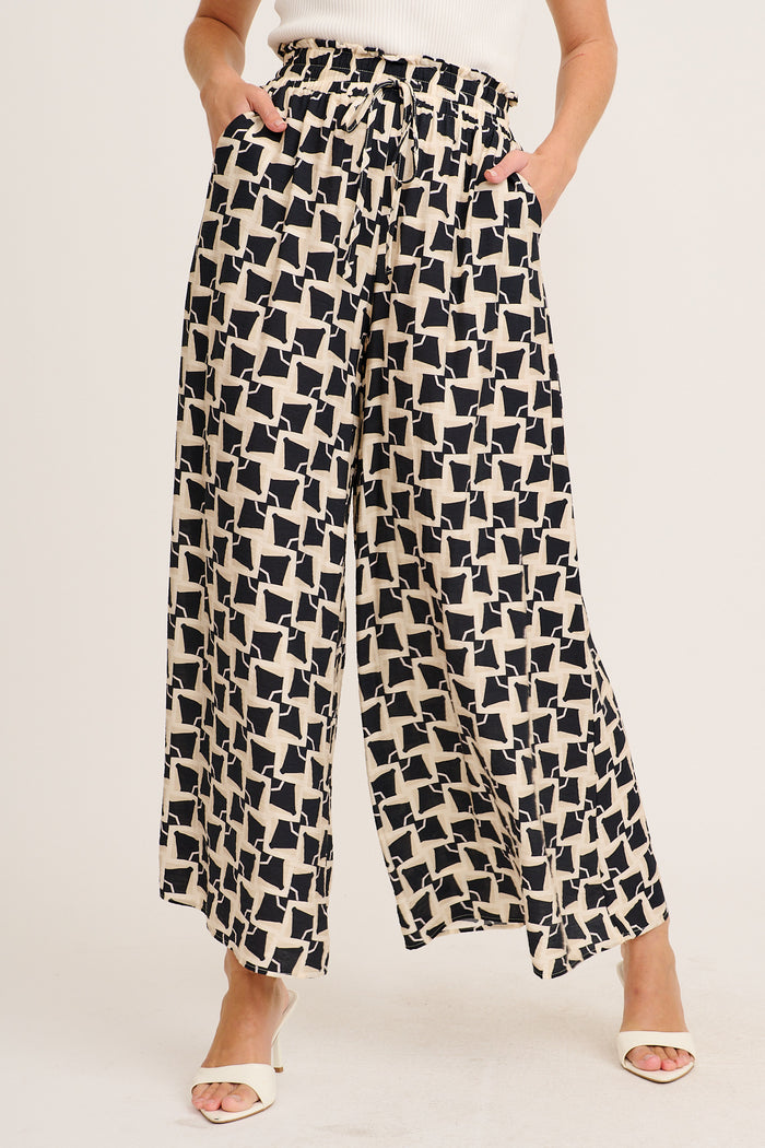 Portia Pant in Beige with Black Print front