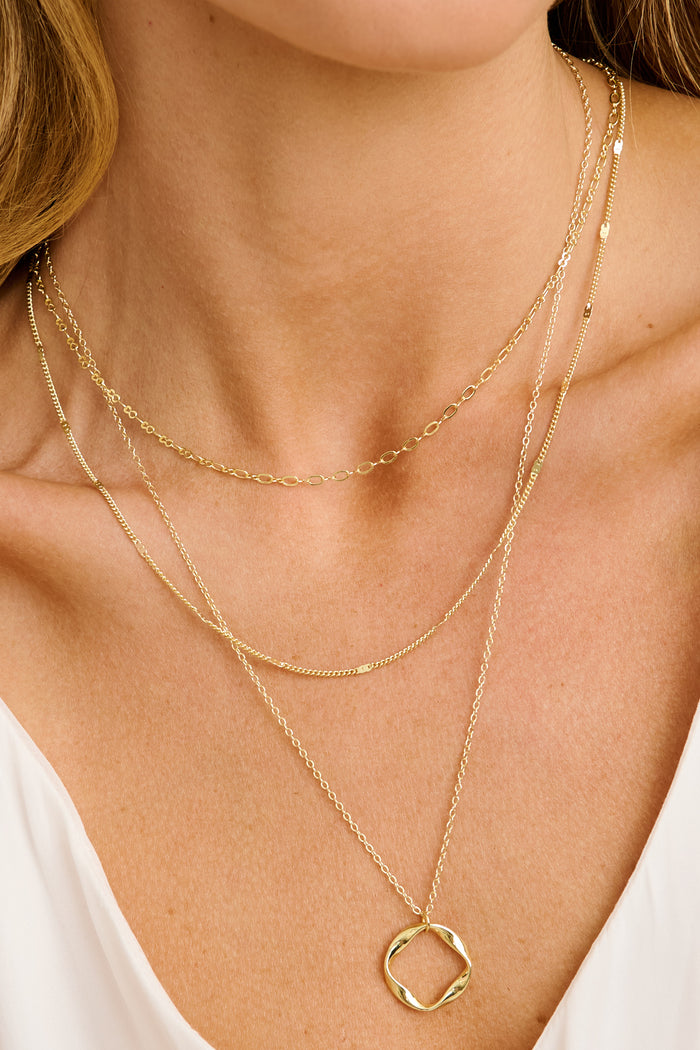 Raina Layered Necklace in Gold on model close up