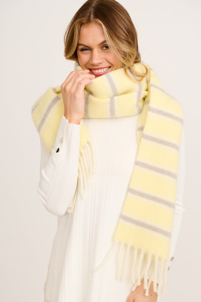 Chloe Knit Scarf in Butter Yellow Stripe on model close up