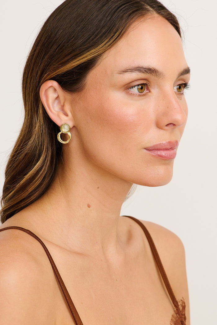 Lina Stud Earrings in Gold with Green Stone on model side