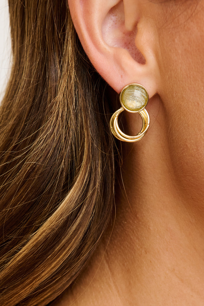 Lina Stud Earrings in Gold with Green Stone on model close up