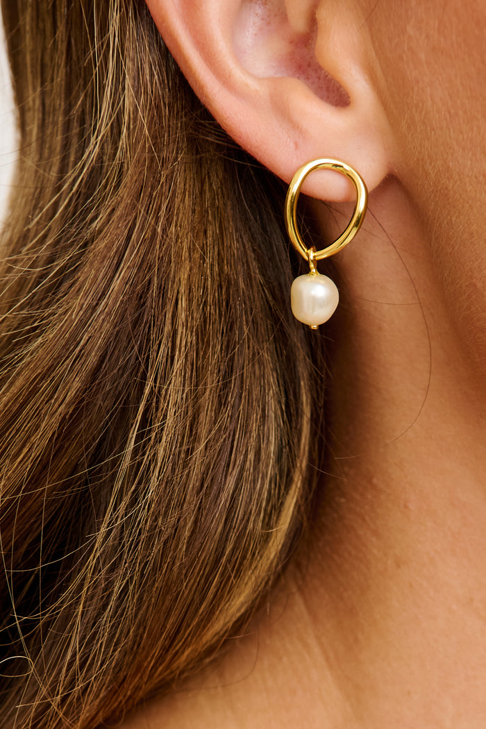 Alana Drop Earrings in Gold with Pearl on model close up