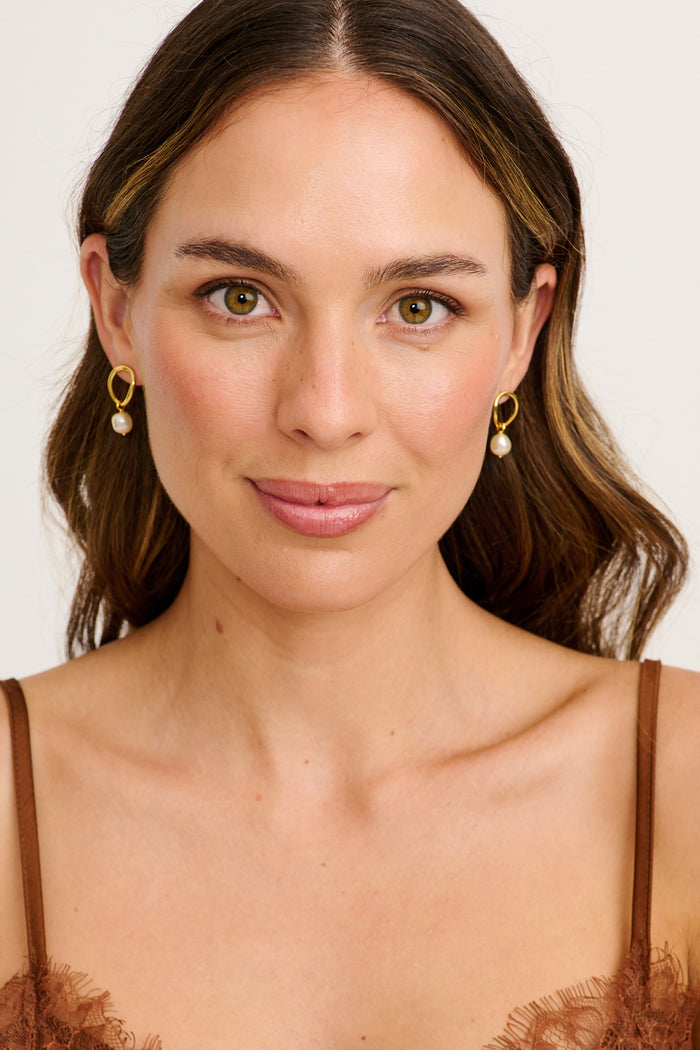 Alana Drop Earrings in Gold with Pearl on model front