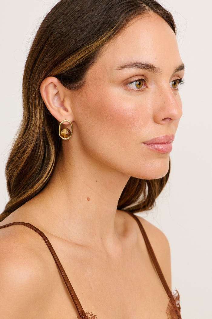 Sienna Resin Drop Earrings in Gold with Brown Resin on model side