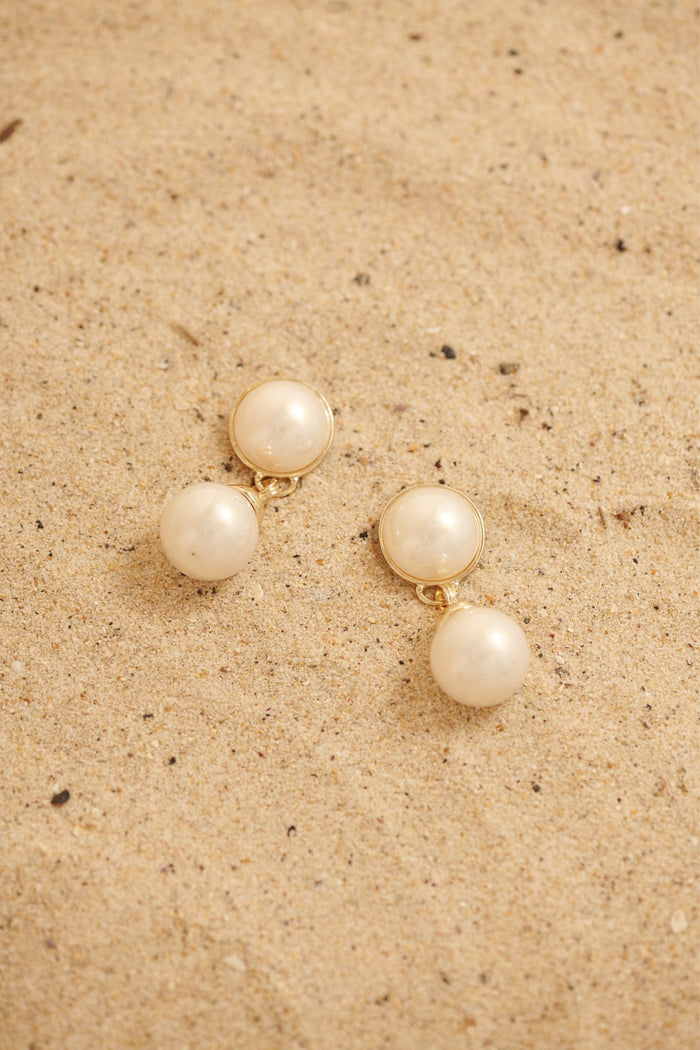 Carla Drop Earrings in Gold with Pearl focus shoot flatlay